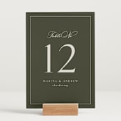 "refined" - Table Numbers in Deep Olive by Nicole Walsh - Displayed (stand not included)