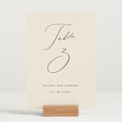 "Scripted Names" - Table Numbers in Ecru by Hooray Creative - Displayed (stand not included)