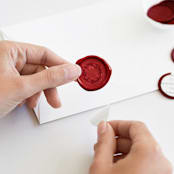 "Holiday Wreath in Red (pack of 25)" - Wax Seals, Pack of 25 in Sangria by Melanie Kosuge - Adhesive Backer