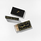 "Sagittarius Matchboxes, Black and Gold, Pack of 4" - Matchbooks and Matches in natural by ForYourParty