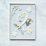 "Gold-Lined Pressed Flower Table Number, White" - Table Numbers in gold by Jasmine Jhunjhnuwala