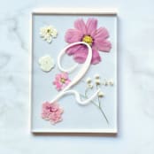 "Gold-Lined Pressed Flower Table Number, Pink" - Table Numbers in pink by Jasmine Jhunjhnuwala