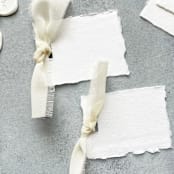 "Handmade Paper Place Cards with Ivory Bow | Set of 10 | Custom Text" - Place and Escort Cards in white by Cotton and Bow