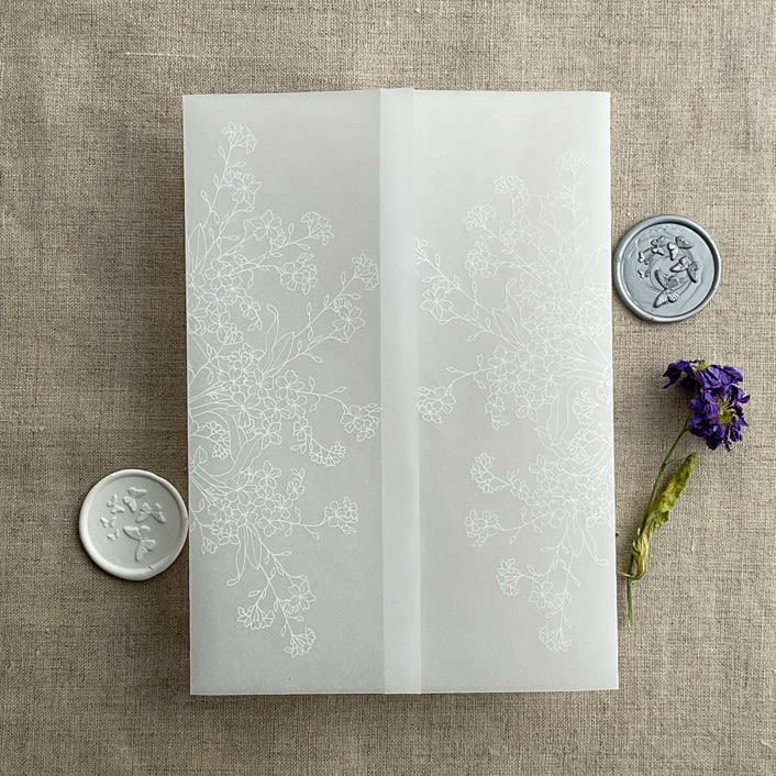 "White print flower arrangement printed vellum wrap for 5x7 card  | pack of 10" - Invitation Jackets and Overlays in white by Ivory Invitations