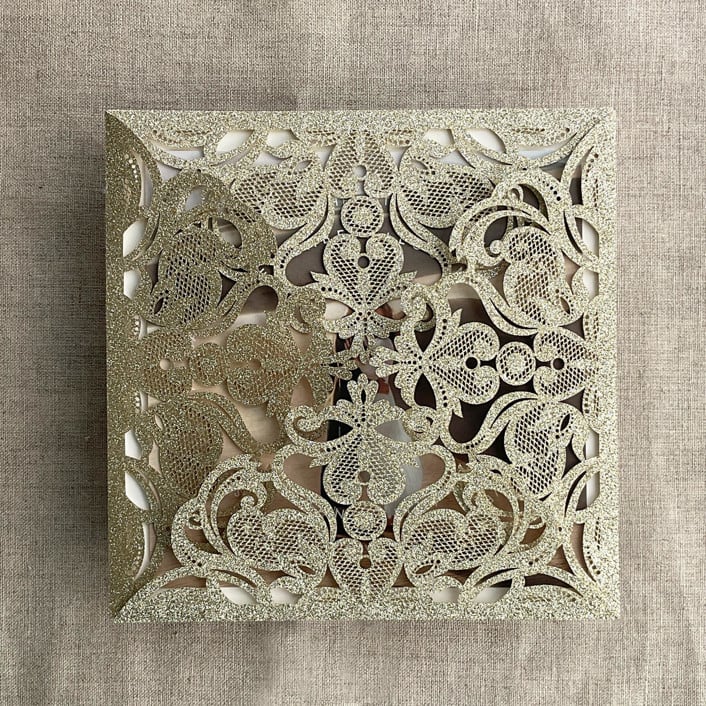 "Champagne gold glitter lace laser cut square petal fold | pack of 10" - Invitation Pockets in gold by Ivory Invitations