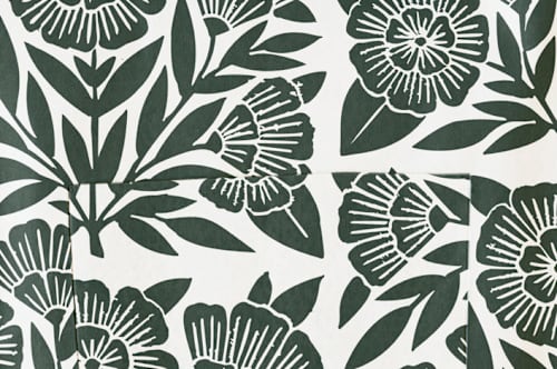 This is a dark teal aprons by Katharine Watson called block print floral in standard