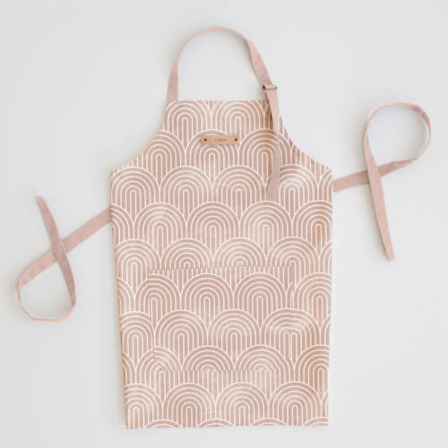 This is a pink aprons by Hooray Creative called deco arches in standard