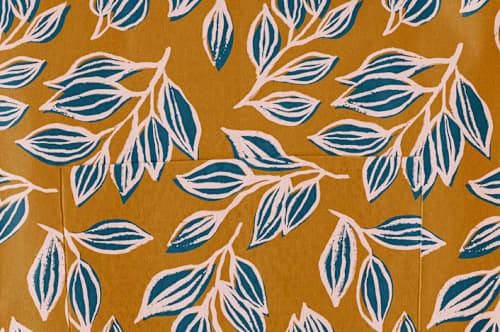 This is a mustard aprons by Alicia Schultz called wandering in standard