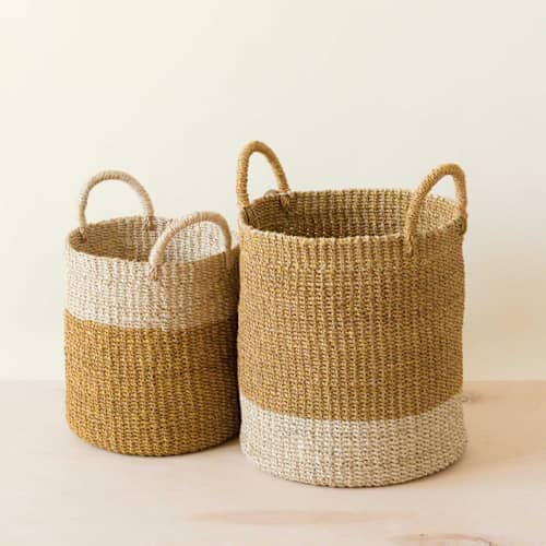 This is a yellow accent pieces by LIKHA called mustard cylinder basket with handles, nested set of 2 in standard