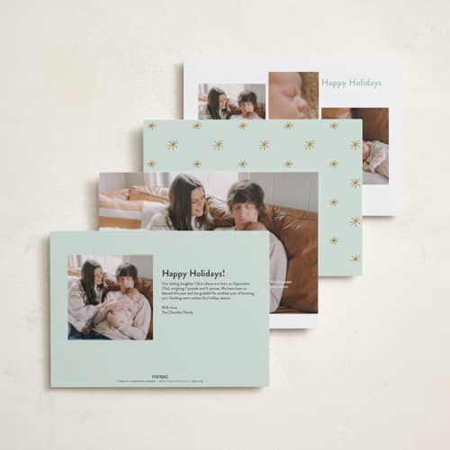 This is a golden babys first christmas with standard by Carolyn MacLaren called the more, the merrier printing on recycled smooth signature in standard