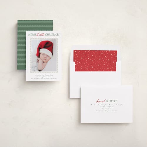 This is a holly babys first christmas with standard by Hooray Creative called merry scallop printing on recycled smooth signature in standard