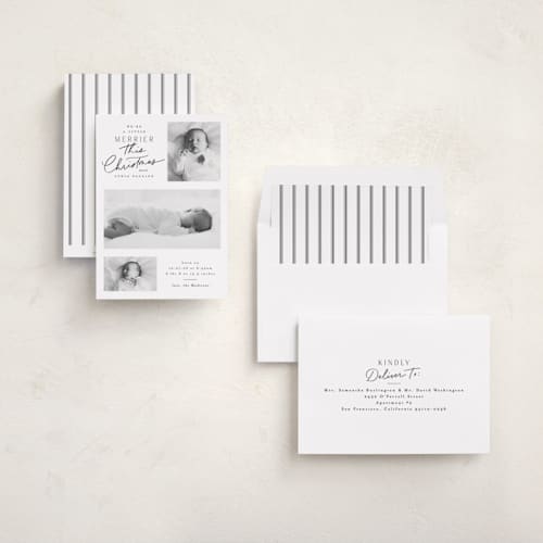 This is a snow babys first christmas with standard by Everett Paper Goods called merrier this year printing on recycled smooth signature in standard