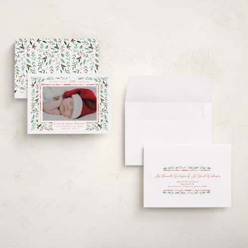 This is a tangerine babys first christmas with standard by Alethea and Ruth called merry little christmas greenery printing on recycled smooth signature in grand