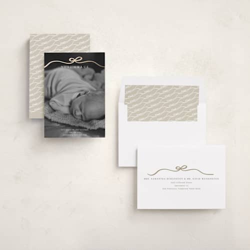 This is a cotton foil stamped birth announcements with foil pressed by Kaydi Bishop called bow tied printing on recycled smooth signature in standard