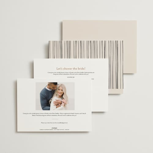 This is a creme bridal shower invitations with standard by Anastasia Makarova called cheers to a happy couple printing on signature in standard