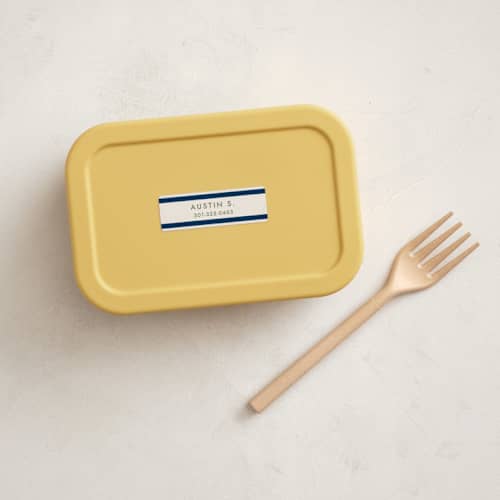 This is a navy name labels with standard by Megan Davis called montauk printing on waterproof sticker paper in sticker