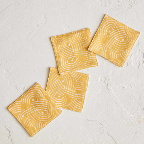 This is a golden table linens by Lise Gulassa called sunshine wave in standard