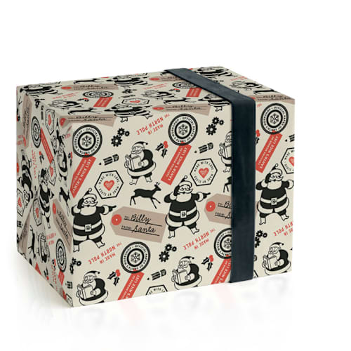 This is a santa wrapping paper with standard by Snow and Ivy called santa's workshop official printing on wrapping paper in standard