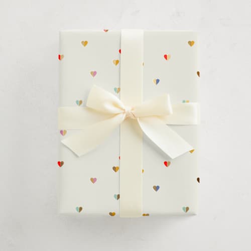 This is a vanilla wrapping paper by Sumak Studio called tiny hearts in standard