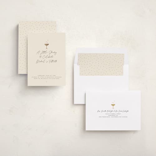 This is a champagne holiday party invitations with foil pressed by mo kelley called a little shindig printing on signature in standard