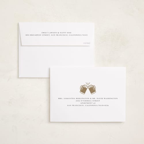 This is a creme holiday party invitations with foil pressed by mo kelley called raise a glass printing on signature in standard