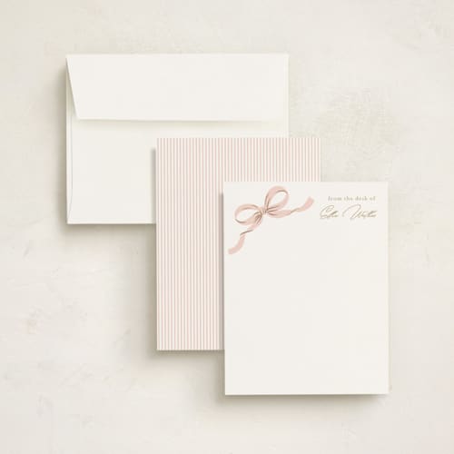This is a blush foil stamped stationery with foil pressed by Paper Raven Co. called a little bow printing on signature in 4.25x5.5
