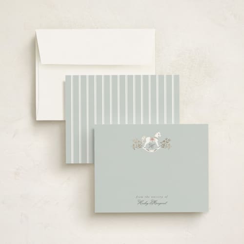 This is a french blue foil stamped stationery with foil pressed by Ana de Sousa called the heirloom rocking horse printing on signature in 4.25x5.5