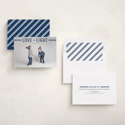 This is a navy hanukkah cards with standard by Jen Banks called love + light printing on recycled smooth signature in standard