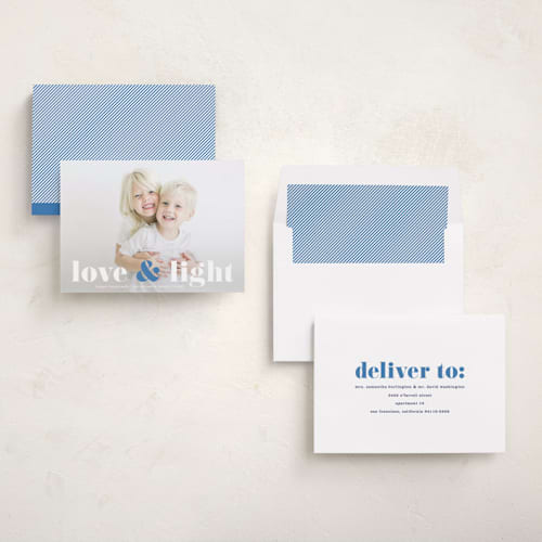 This is a denim hanukkah cards with standard by Kerry Doyle called love & light type printing on recycled smooth signature in standard