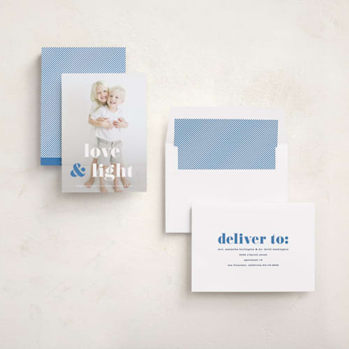 This is a denim hanukkah cards with standard by Kerry Doyle called love & light type printing on recycled smooth signature in standard