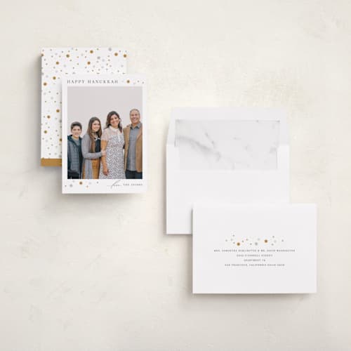 This is a candlelight hanukkah cards with standard by Laura Bercovich called sparkling printing on recycled smooth signature in standard