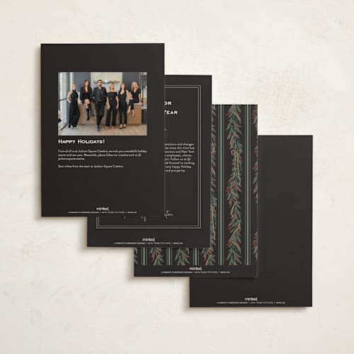 This is a charcoal business holiday cards with foil pressed by Leah Bisch called holly garland printing on signature in standard