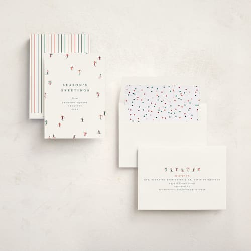 This is a forest business holiday cards with standard by Ellen Schlegelmilch called festive skiers printing on signature in standard