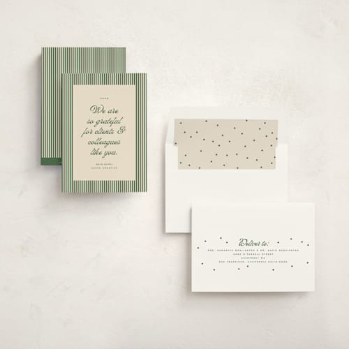 This is a pine business holiday cards with standard by Ellen Schlegelmilch called pinstriped border printing on signature in standard