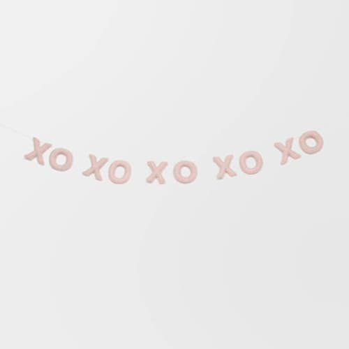 This is a pink holiday decorations by Nivas Collection called xoxo banner (blush, 6 feet) in standard