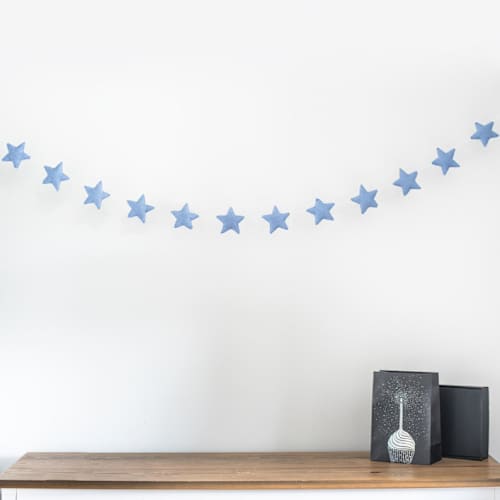 This is a blue holiday decorations by Nivas Collection called star garland (serenity blue, 6 feet) in standard