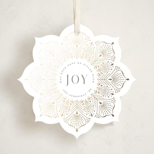 This is a snow holiday card ornaments with foil pressed by Ana de Sousa called poinsettia ornament printing on signature in ornament