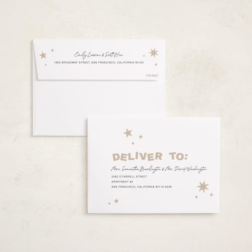 This is a champagne foil pressed holiday cards with foil pressed by Kercia Jane called big year energy printing on recycled smooth signature in standard