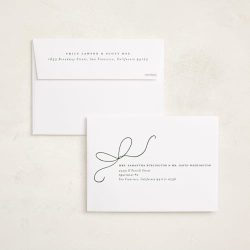 This is a holly foil pressed holiday cards with foil pressed by Emily Betts called bow two printing on recycled smooth signature in standard
