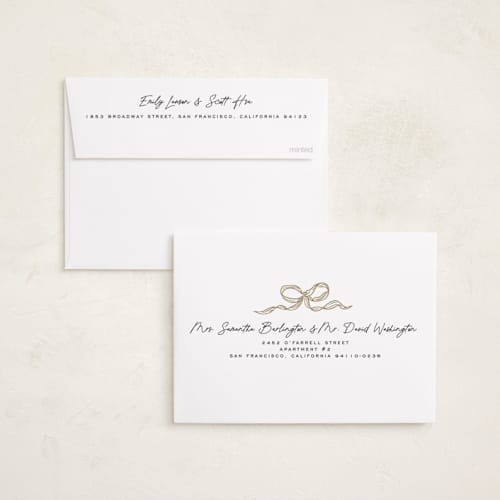 This is a vanilla foil pressed holiday cards with foil pressed by Creo Study called shimmering bow tie printing on recycled smooth signature in standard