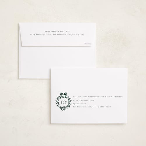 This is a evergreen foil pressed holiday cards with foil pressed by Melanie Kosuge called monogram trio printing on recycled smooth signature in standard