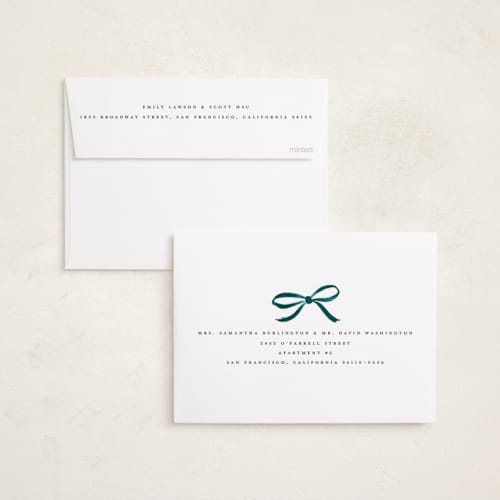 This is a mist foil pressed holiday cards with foil pressed by Olivia Kanaley Inman called crimson bow printing on recycled smooth signature in standard