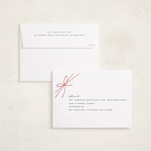 This is a birch foil pressed holiday cards with foil pressed by Leia Matt called tied with joy printing on recycled smooth signature in standard