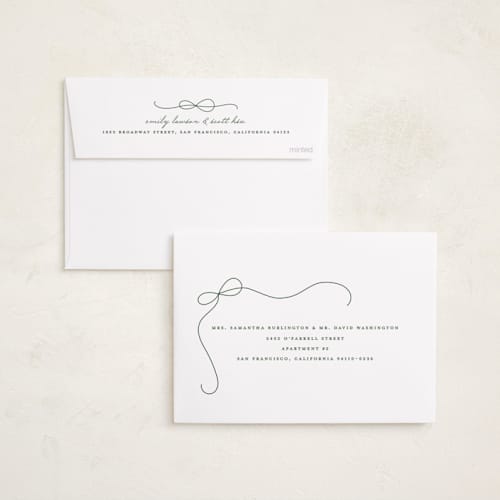 This is a snow foil pressed holiday cards with foil pressed by Lauren Chism called cascading bow printing on recycled smooth signature in standard