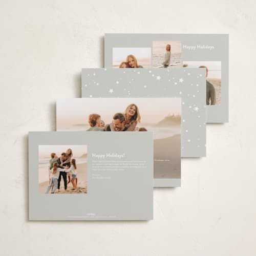 This is a snowy gloss press holiday cards with gloss press by Carolyn Nicks called confetti stars printing on recycled smooth signature in standard