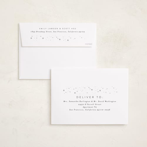 This is a snowy gloss press holiday cards with gloss press by Carolyn Nicks called confetti stars printing on recycled smooth signature in standard