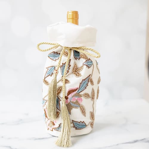 This is a multicolor wrapping paper by Courtney Bedi called white pink blue celebration gift wine bottle bag in standard