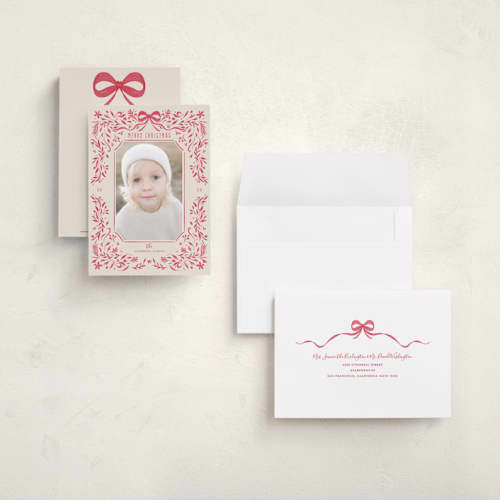This is a poinsettia petite holiday cards with standard by Anne Ciotola called one red bow printing on recycled smooth signature in petite