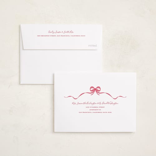 This is a poinsettia petite holiday cards with standard by Anne Ciotola called one red bow printing on recycled smooth signature in petite