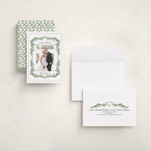 This is a pine petite holiday cards with standard by Susan Moyal called framed in holly printing on signature in petite